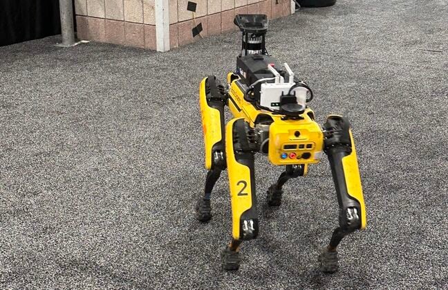 Boston Dynamics' Spot robodog explores the Siggraph 2024 showfloor.